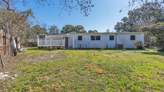 back of house with a yard