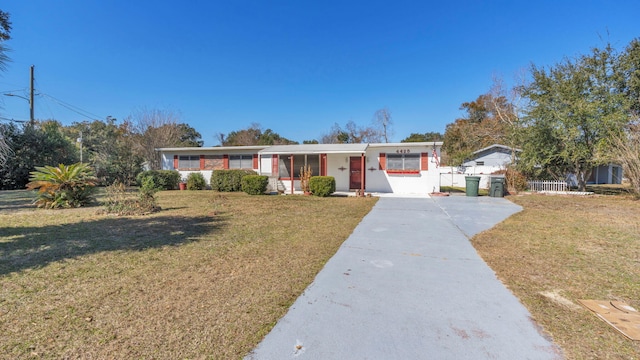 ranch-style home with a front yard