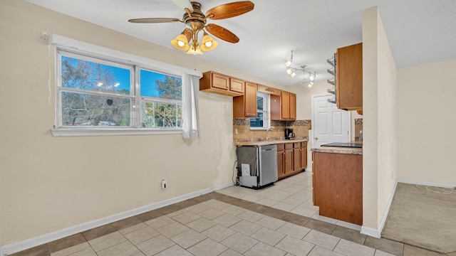 kitchen with sink, tasteful backsplash, light tile patterned floors, dishwasher, and ceiling fan