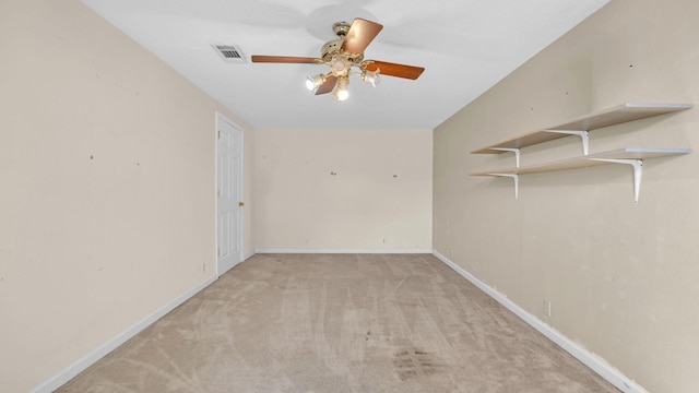 carpeted empty room with ceiling fan