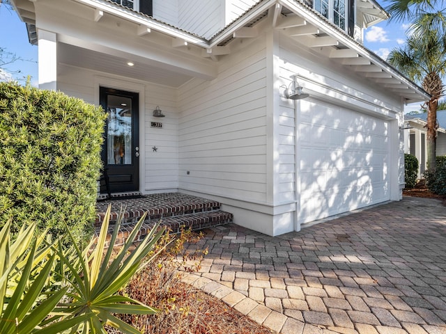 doorway to property featuring a garage