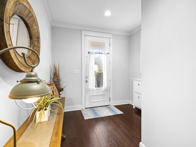 foyer featuring crown molding and dark hardwood / wood-style floors