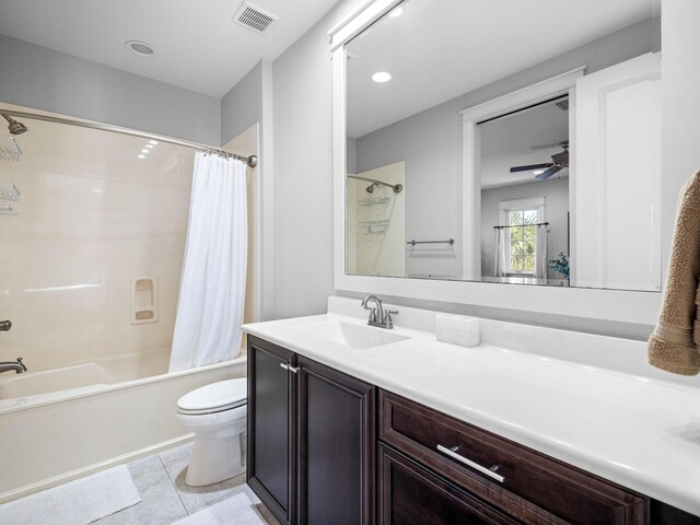 full bathroom featuring toilet, tile patterned floors, vanity, ceiling fan, and shower / bathtub combination with curtain