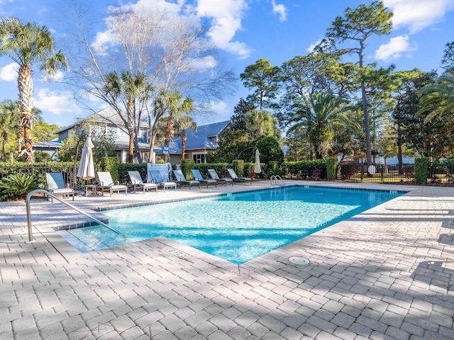 view of swimming pool featuring a patio area