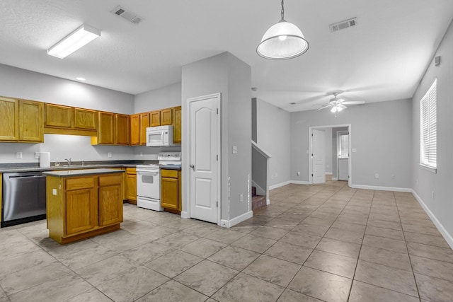 kitchen with sink, a center island, ceiling fan, pendant lighting, and white appliances