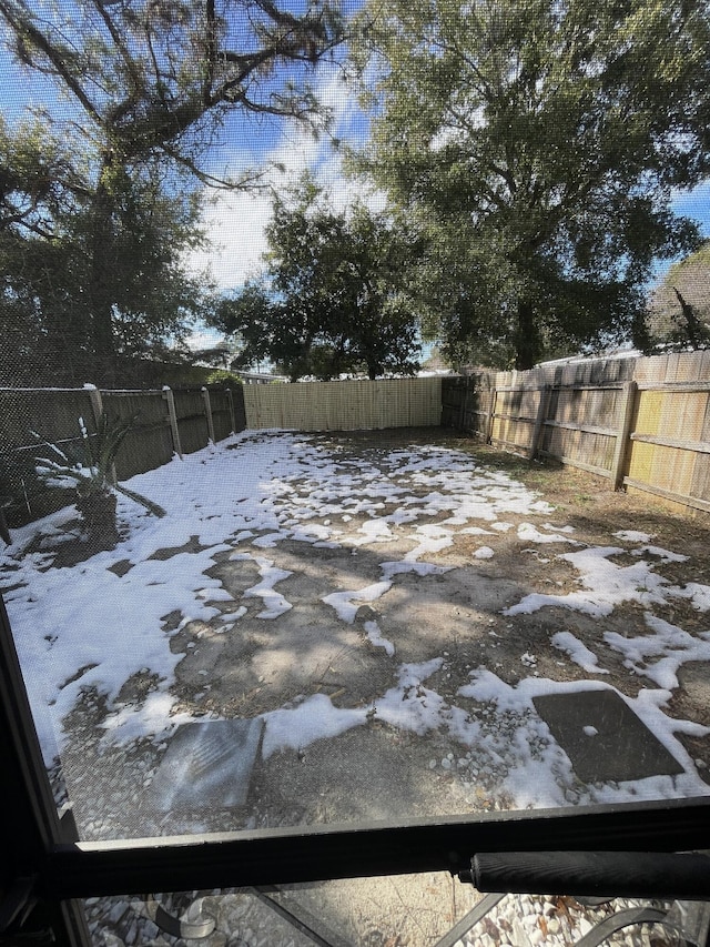 view of yard covered in snow