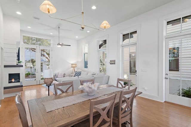 dining room featuring light hardwood / wood-style flooring and ceiling fan