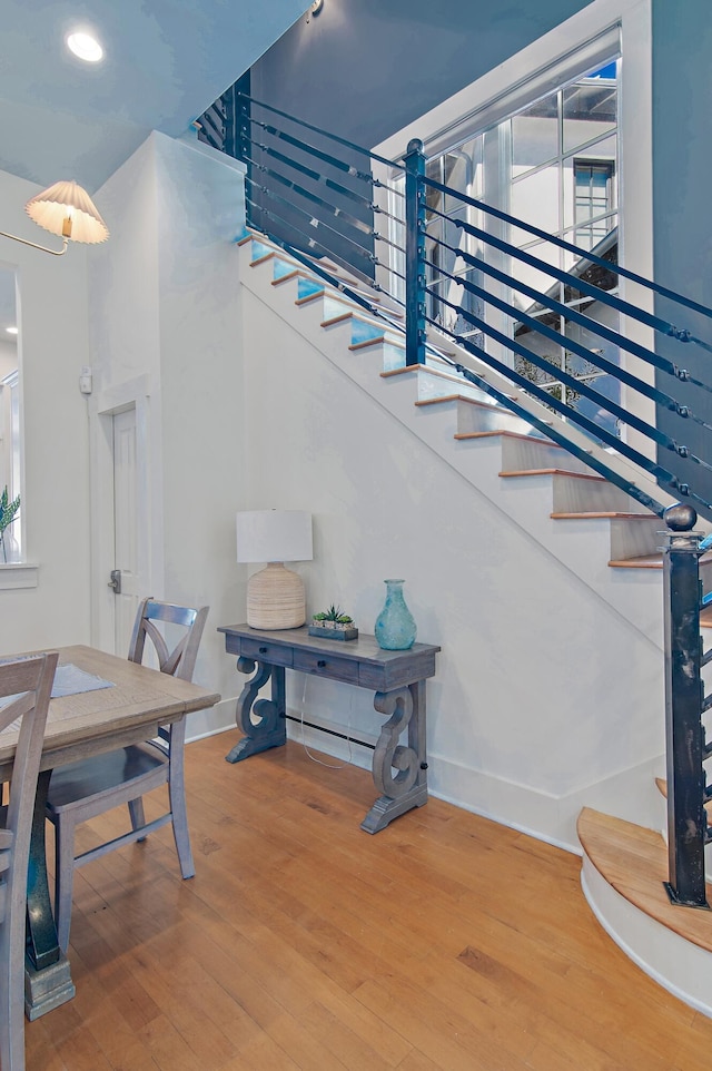 stairway featuring hardwood / wood-style flooring