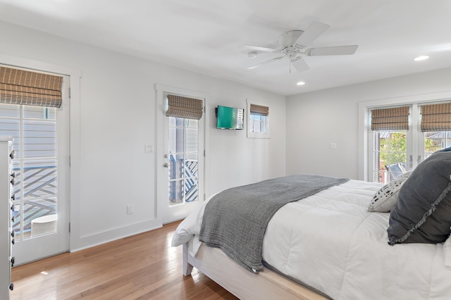 bedroom featuring light hardwood / wood-style flooring, access to outside, and ceiling fan