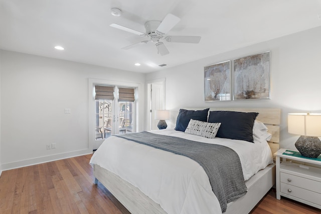 bedroom with wood-type flooring, access to outside, and ceiling fan