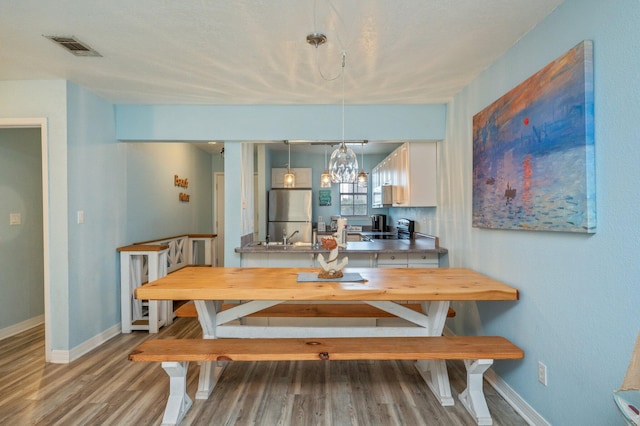 dining room featuring wood-type flooring