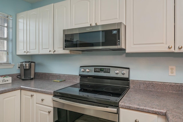 kitchen with white cabinetry and stainless steel appliances