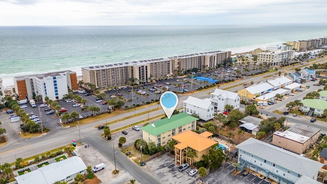 birds eye view of property featuring a view of the beach and a water view