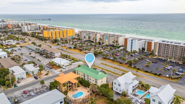 drone / aerial view with a beach view and a water view