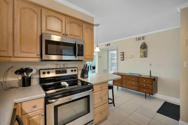 kitchen featuring crown molding, appliances with stainless steel finishes, decorative light fixtures, and light tile patterned floors