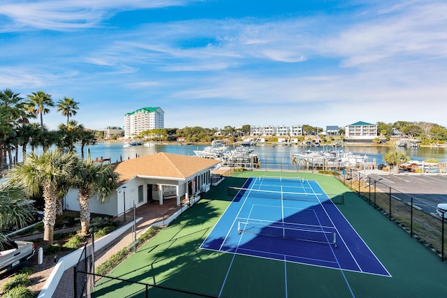 view of sport court with a water view