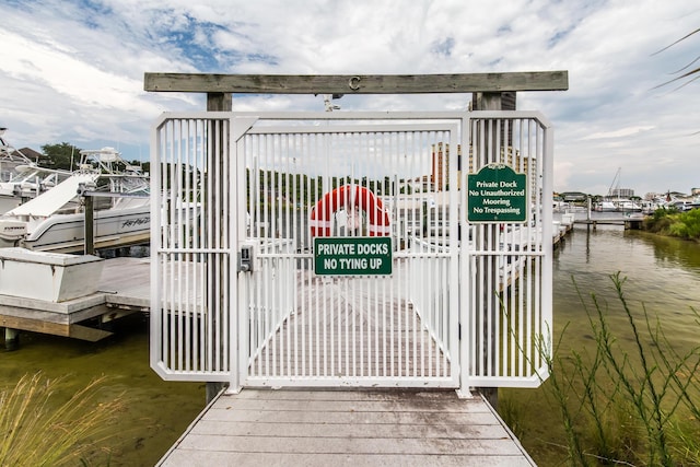 view of gate with a water view