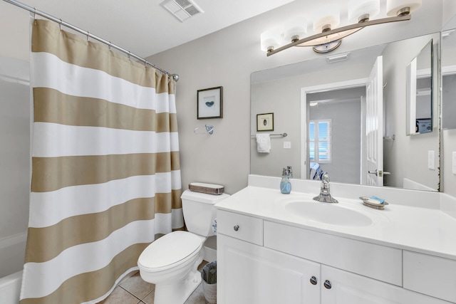 bathroom with curtained shower, toilet, tile patterned floors, and vanity