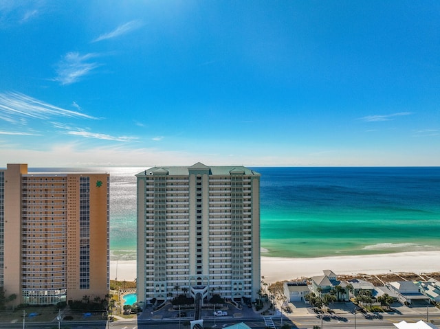 bird's eye view featuring a water view and a beach view