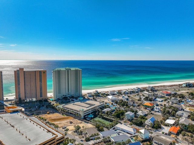 bird's eye view featuring a water view and a view of the beach