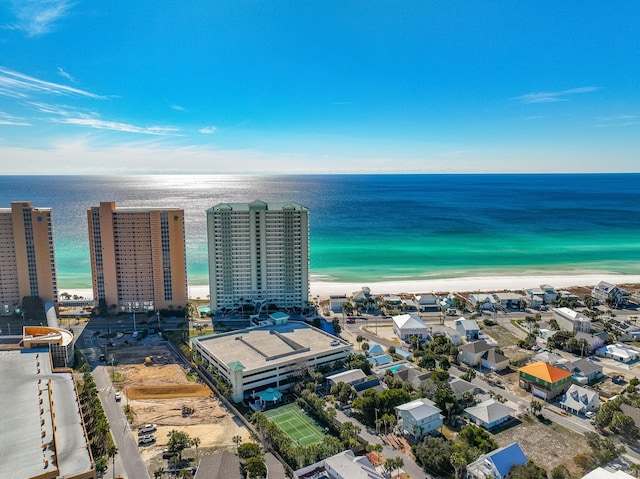 drone / aerial view featuring a water view and a beach view