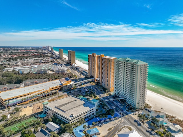 drone / aerial view featuring a water view and a beach view