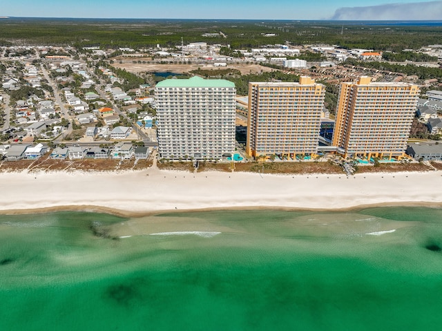 birds eye view of property with a beach view and a water view