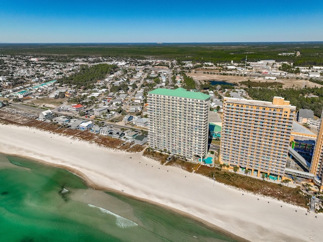 bird's eye view featuring a water view and a view of the beach