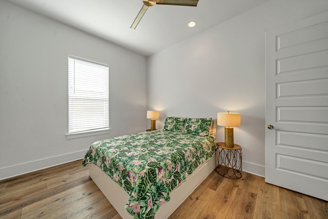 bedroom featuring ceiling fan and hardwood / wood-style flooring