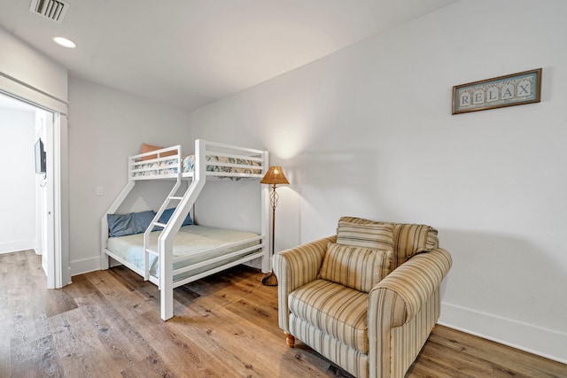 bedroom with hardwood / wood-style floors