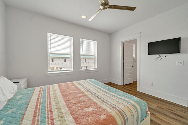 bedroom with hardwood / wood-style floors and ceiling fan