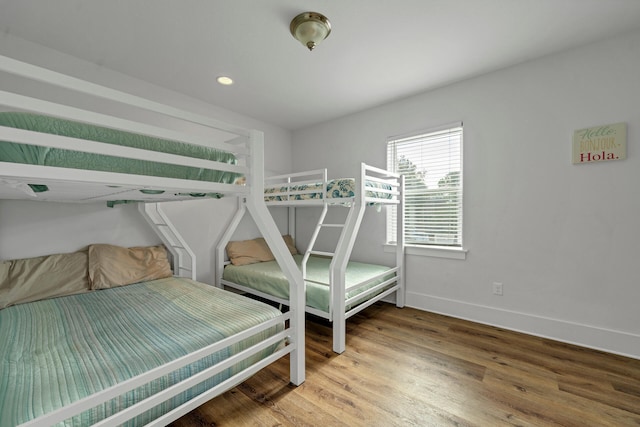 bedroom featuring wood-type flooring