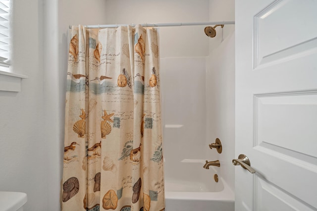 bathroom featuring shower / tub combo with curtain