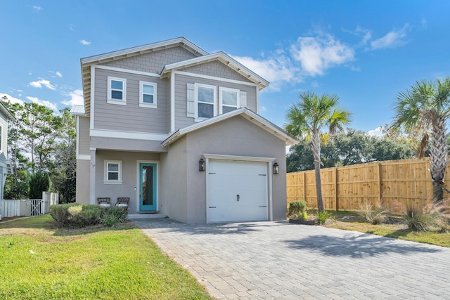 view of front facade featuring a garage and a front yard