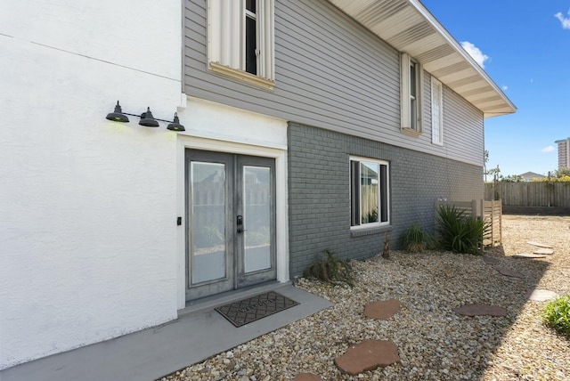 property entrance featuring french doors