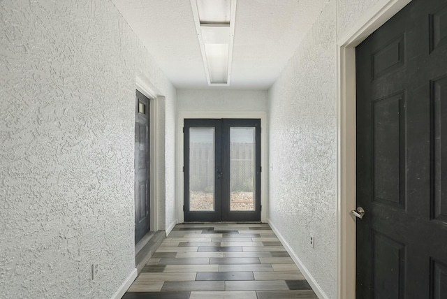 foyer entrance featuring french doors