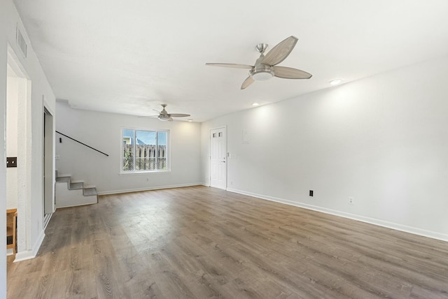 unfurnished living room with ceiling fan and light hardwood / wood-style flooring