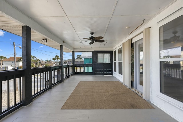 exterior space with ceiling fan