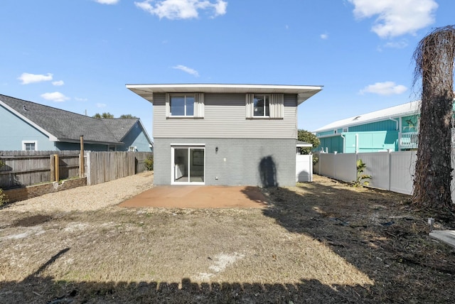 rear view of property featuring a patio area