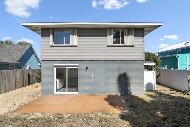 back of property featuring a patio