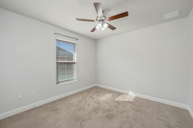 empty room with light carpet and ceiling fan