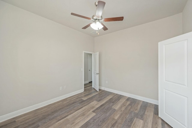 unfurnished room with hardwood / wood-style floors and ceiling fan