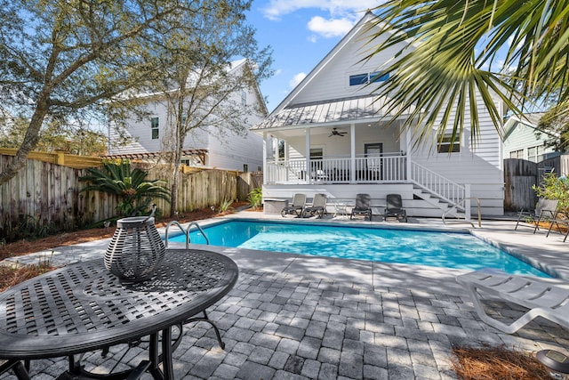 view of pool featuring a patio and ceiling fan