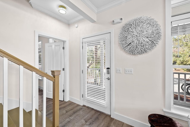 foyer entrance with beam ceiling, wood-type flooring, and crown molding