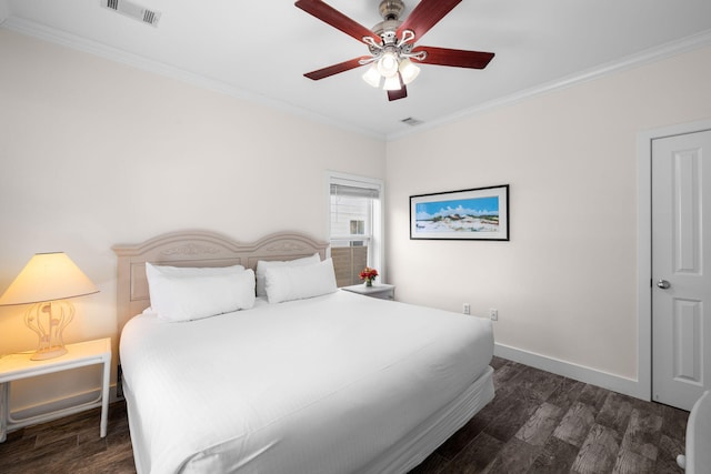 bedroom featuring crown molding, dark wood-type flooring, and ceiling fan