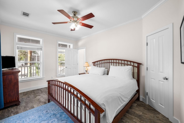 bedroom with crown molding, dark hardwood / wood-style floors, and ceiling fan