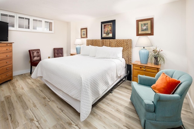 bedroom with light hardwood / wood-style flooring