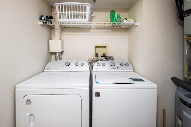 washroom featuring washer and clothes dryer