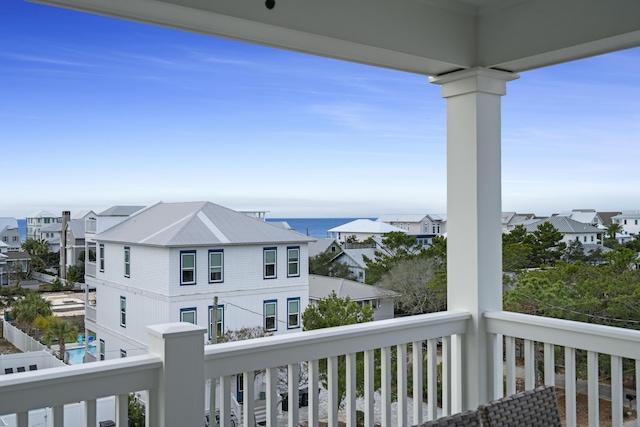 balcony featuring a water view