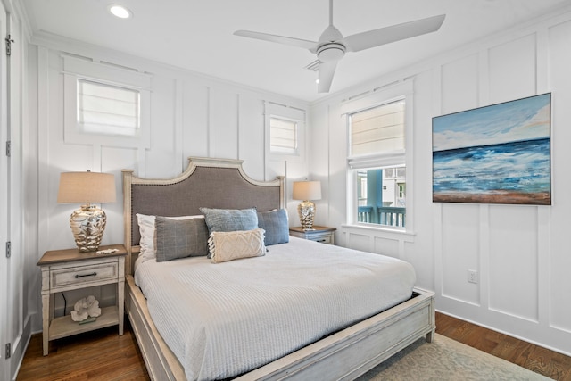 bedroom featuring ceiling fan, crown molding, and dark hardwood / wood-style floors